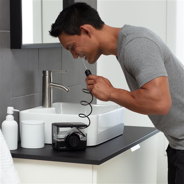 Black Waterpik™ ION Professional Countertop Cordless Water Flosser